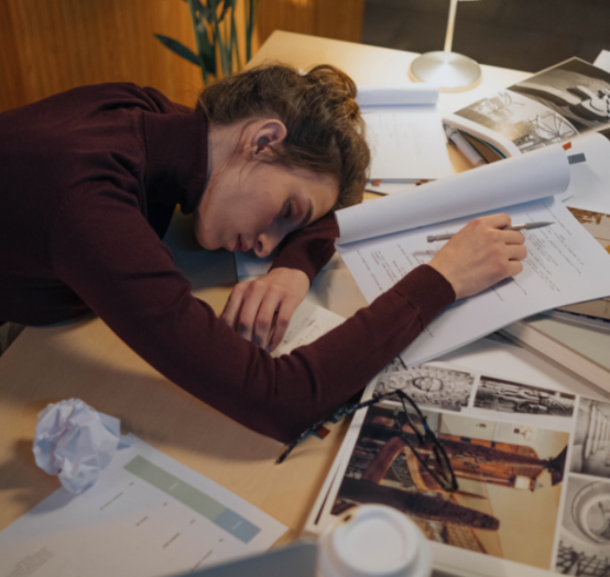 Woman sleeping at work after crunching
